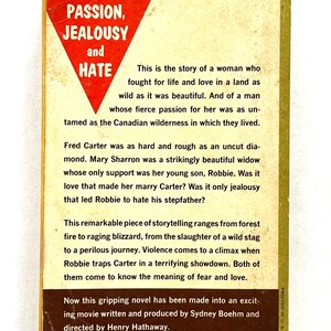 May include: A book cover with a red triangle featuring the words "Passion, Jealousy and Hate". The book is about a woman who fights for life and love in a wild land. The book is a remarkable piece of storytelling that ranges from forest fire to raging blizzard.