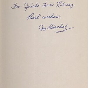 May include: Handwritten inscription on a white page that reads "For Jericho Town Library, Best wishes, Joy Bischoff".