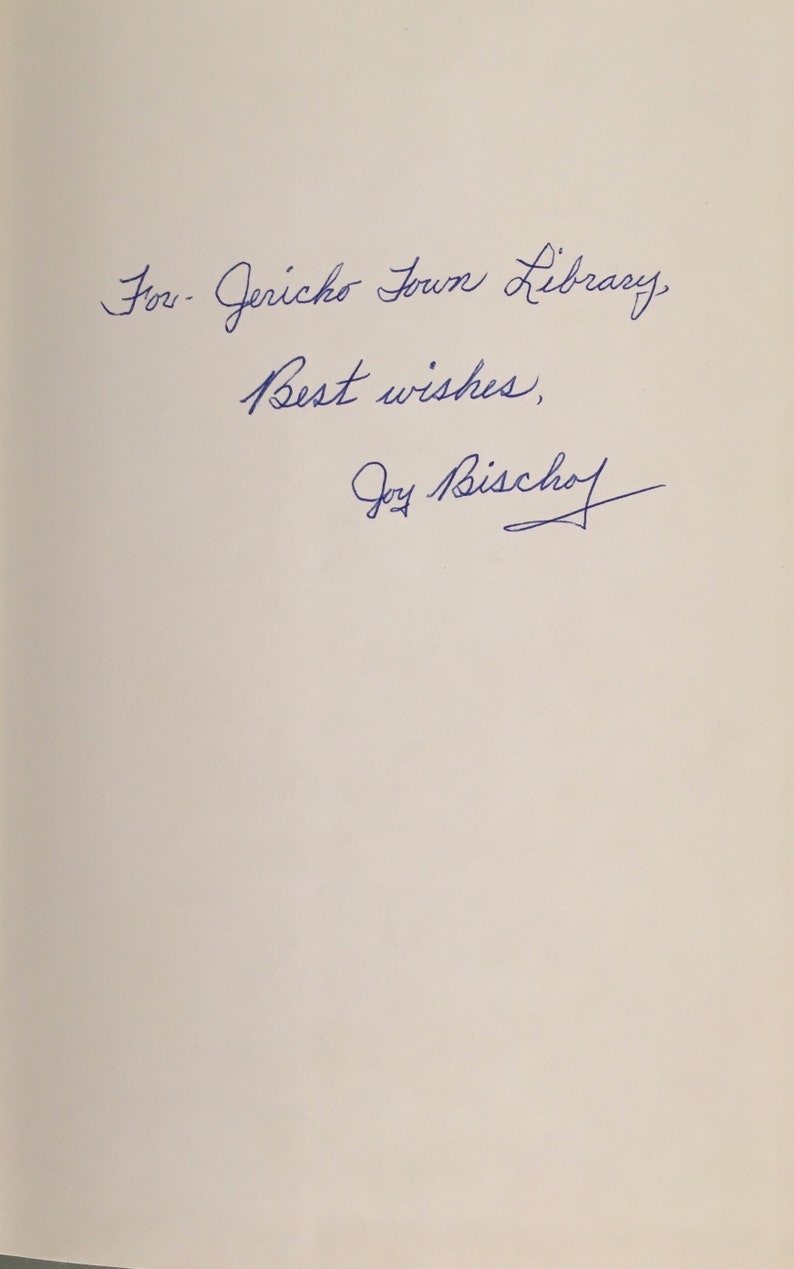 May include: Handwritten inscription on a white page that reads "For Jericho Town Library, Best wishes, Joy Bischoff".