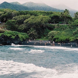 Black Sand Beach Scene | HONOKALANI BEACH | The Road to Hana | Maui, Hawaii | people playing on Black Sand Beach | Maui black sand beach |