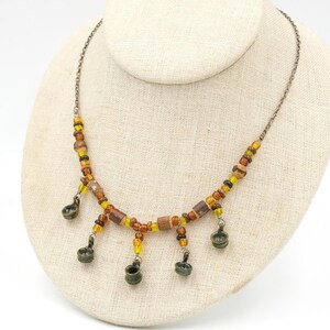 May include: A set of three ceramic mugs with a speckled, matte finish. The mugs are in shades of cream, light gray, and dark gray. Each mug has a simple, minimalist design, perfect for coffee or tea.