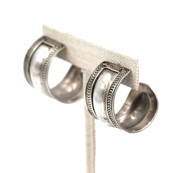 Silver tone basket weave half hoop clip on earrings