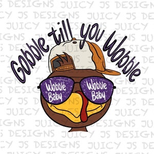 May include: A cartoon turkey wearing a baseball cap and sunglasses with the text "Gobble till you Wobble" and "Wobble Baby" on the sunglasses.