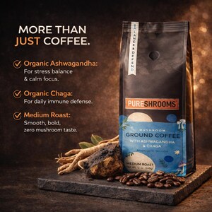 May include: A dark bag of Pureshrooms mushroom ground coffee with ashwagandha and chaga. The bag is on a dark stone surface with coffee beans, ashwagandha root, and chaga mushroom. The bag has the text "MORE THAN JUST COFFEE."