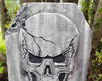 May include: A grey stone Halloween welcome sign with a skull and the word "WELCOME" in red dripping paint.
