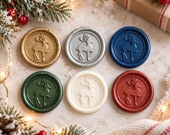 May include: Six circular wax seals arranged in two rows, each featuring an embossed reindeer design. The colors include metallic gold, silver, dark blue, forest green, off-white, and deep red, all with a smooth, raised finish and border.