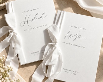 May include: Two white hardcover books with white ribbon ties. One book reads A LETTER TO MY Husband ON OUR WEDDING DAY, the other reads A LETTER TO MY Wife ON OUR WEDDING DAY. Both feature PETERSON HOUSE 27 | 04 | 2024 printed in black text.
