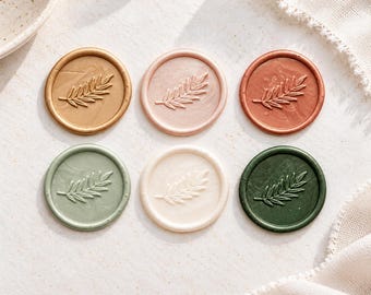 May include: Six circular wax seals arranged in two rows of three. Each seal features a raised embossed fern leaf design. The colors include metallic gold, soft pink, copper, sage green, cream, and dark forest green with a smooth finish.
