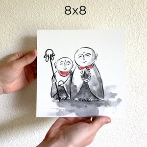 May include: Watercolor painting of two cartoon monks, one holding a staff with a hand at the top, the other holding prayer beads. The monks are wearing traditional robes and have a serene expression on their faces. The painting is on a white background.