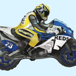 May include: A yellow, blue, and black foil balloon shaped like a motorcycle with a rider wearing a helmet. The motorcycle has the word "REDS" on the side and the number "23" on the front wheel.