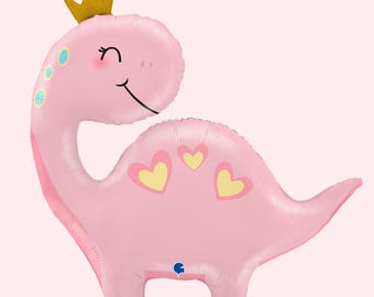May include: A pink dinosaur-shaped foil balloon featuring a gold crown on its head, a long neck, and three yellow hearts with pink outlines on its back. The dinosaur has a smiling face with closed eyes and small blue spots along its neck.