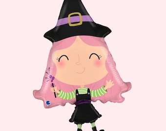 May include: A foil balloon shaped like a cartoon witch with pink hair, wearing a black hat with a purple band and gold buckle, a black dress over a green and white striped long-sleeve shirt, and black boots, holding a small purple magic wand.
