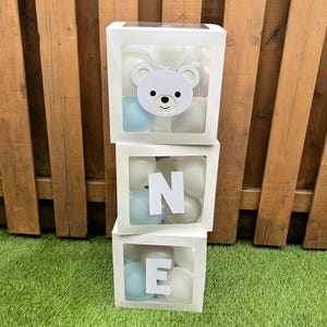 May include: A distressed wooden sign displaying the word "Welcome" in white lettering. The sign has a rustic appearance, ideal for a porch or hallway, and is designed with a simple, welcoming aesthetic.