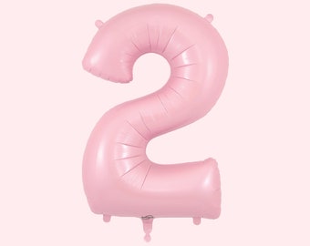 May include: A large, light pink number two balloon, perfect for a birthday celebration. The balloon is inflated and has a shiny surface. The number is in a bold, rounded font, and is designed to stand upright. The balloon is a party decoration.