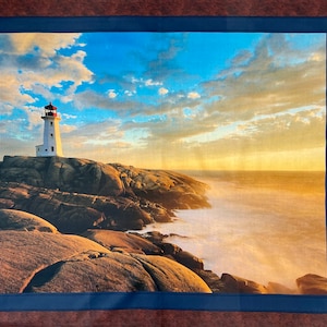 May include: A white lighthouse with a red roof stands on a rocky cliff overlooking a vast ocean. The sky is a vibrant blue with fluffy white clouds, and the water is a calm, golden color. The sun is setting in the distance, casting a warm glow over the scene.