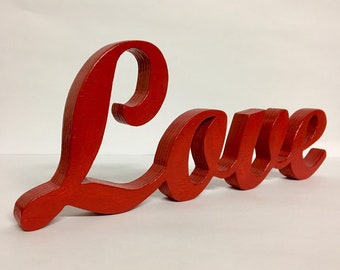 LOVE Inscription in red wood thickness 1.9 cm