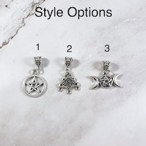 May include: Three silver charm options for a necklace or bracelet. Option 1 features a pentacle, option 2 features a triple goddess symbol, and option 3 features a crescent moon with a pentacle.