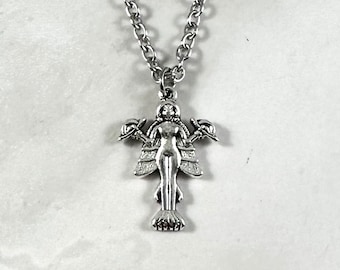 May include: A silver necklace with a pendant of a mermaid with wings and a crown. The pendant is detailed and has a textured finish.