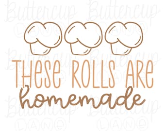 May include: A graphic design featuring three chef hats above the text "THESE ROLLS ARE homemade" in a brown color. The design is on a white background.