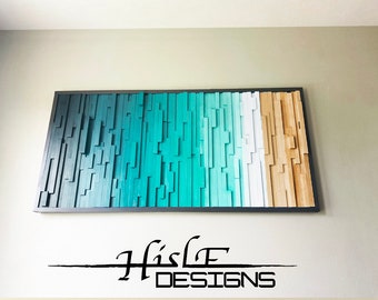 May include: A large, rectangular wall art piece made of wood. The wood is arranged in a vertical pattern and painted in shades of blue, white, and brown, creating a gradient effect. The piece is framed in black.