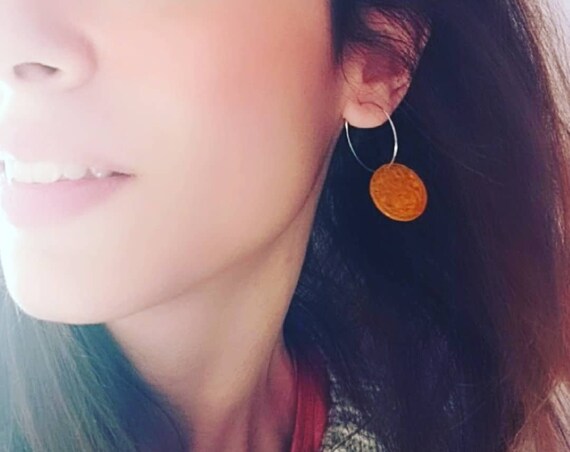 Pendientes exclusivos de acero hipoalergénicos con amuleto de jade