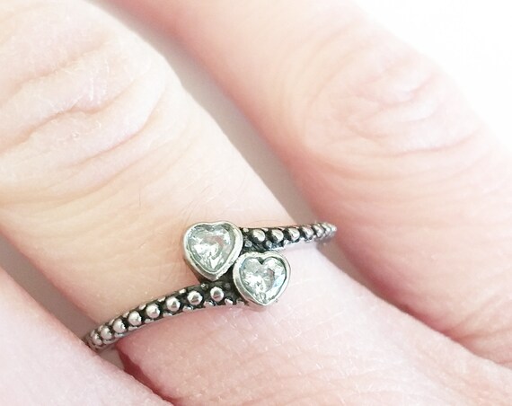 Anillo de acero dos corazones