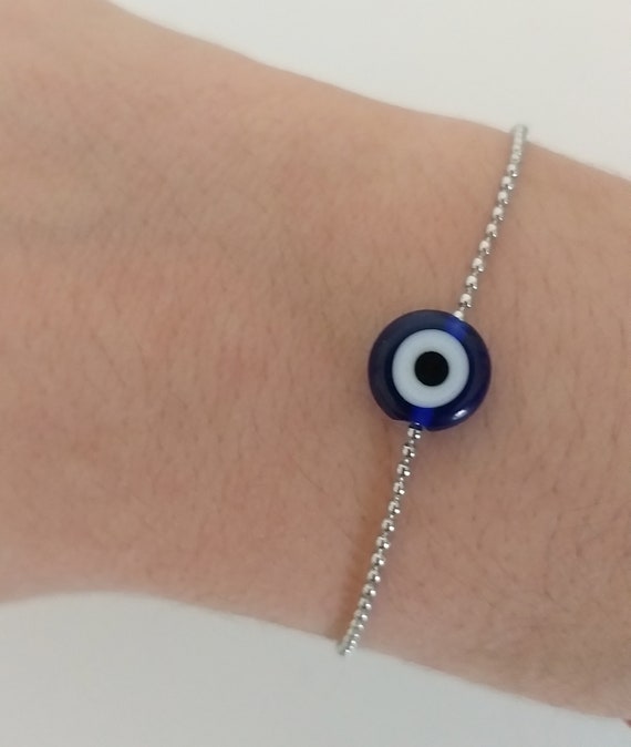 Pulsera ojo protector y cadena de acero