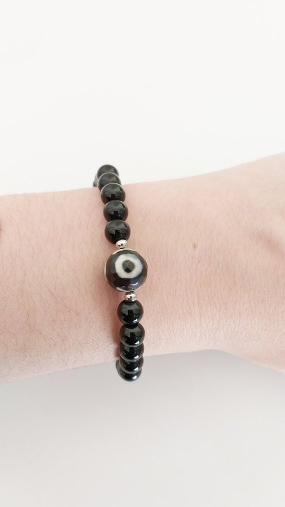 Pulsera protectora: ónix y ojo tibetano