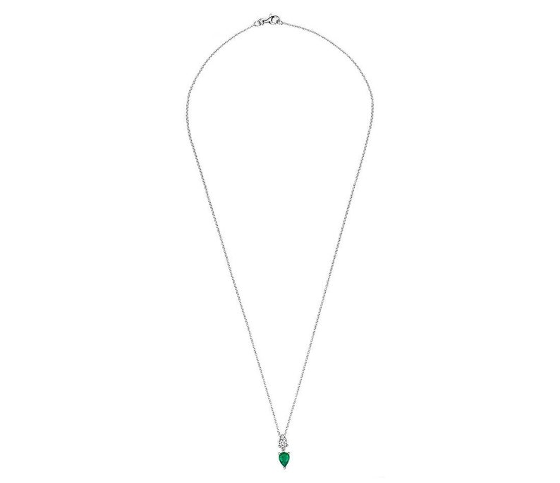 May include: A delicate silver necklace featuring a pear-shaped, emerald-green gemstone pendant accented with a small, round, clear gemstone. The pendant hangs from a fine silver chain, creating a simple yet elegant design.