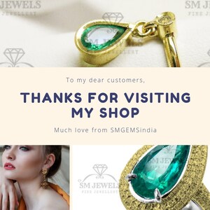 May include: A close-up of a pear-shaped emerald gemstone ring set in gold and silver. The ring has a textured band and a large emerald gemstone in the center. The image also includes a smaller emerald gemstone pendant on a gold chain.