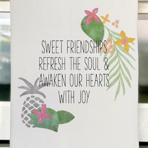 May include: White kitchen towel with a tropical design and the text "Sweet friendships refresh the soul & awaken our hearts with joy".
