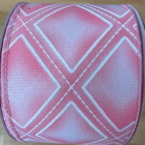 May include: Pink and white ribbon with a diamond pattern. The ribbon is made of a soft, textured fabric and has a subtle ombre effect.