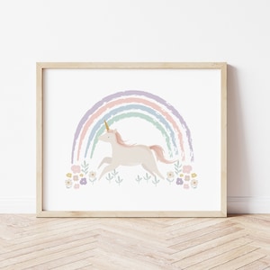 May include: A white unicorn with a gold horn runs under a rainbow with pastel colours. The rainbow is made of brushstrokes and is surrounded by small pink, purple and yellow flowers.