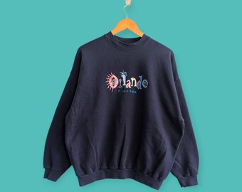 Sudadera vintage de los años 90 de Orlando, Florida, con cuello redondo y logotipo bordado, estilo urbano, color azul, talla extragrande.