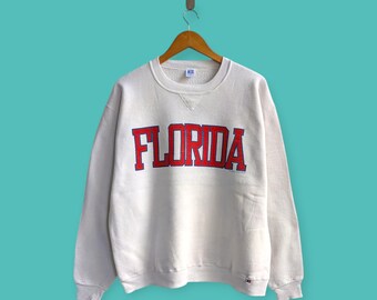 ヴィンテージ 80年代 90年代 フロリダ大学 スペルアウト スウェットシャツ フロリダ ゲイターズ クルーネック セーター プルオーバー カレッジスタイル ホワイトカラー サイズ XL