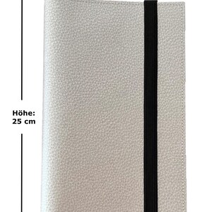 May include: A light gray leather notebook with a black elastic closure. The notebook measures 16 inches wide and 25 inches tall.