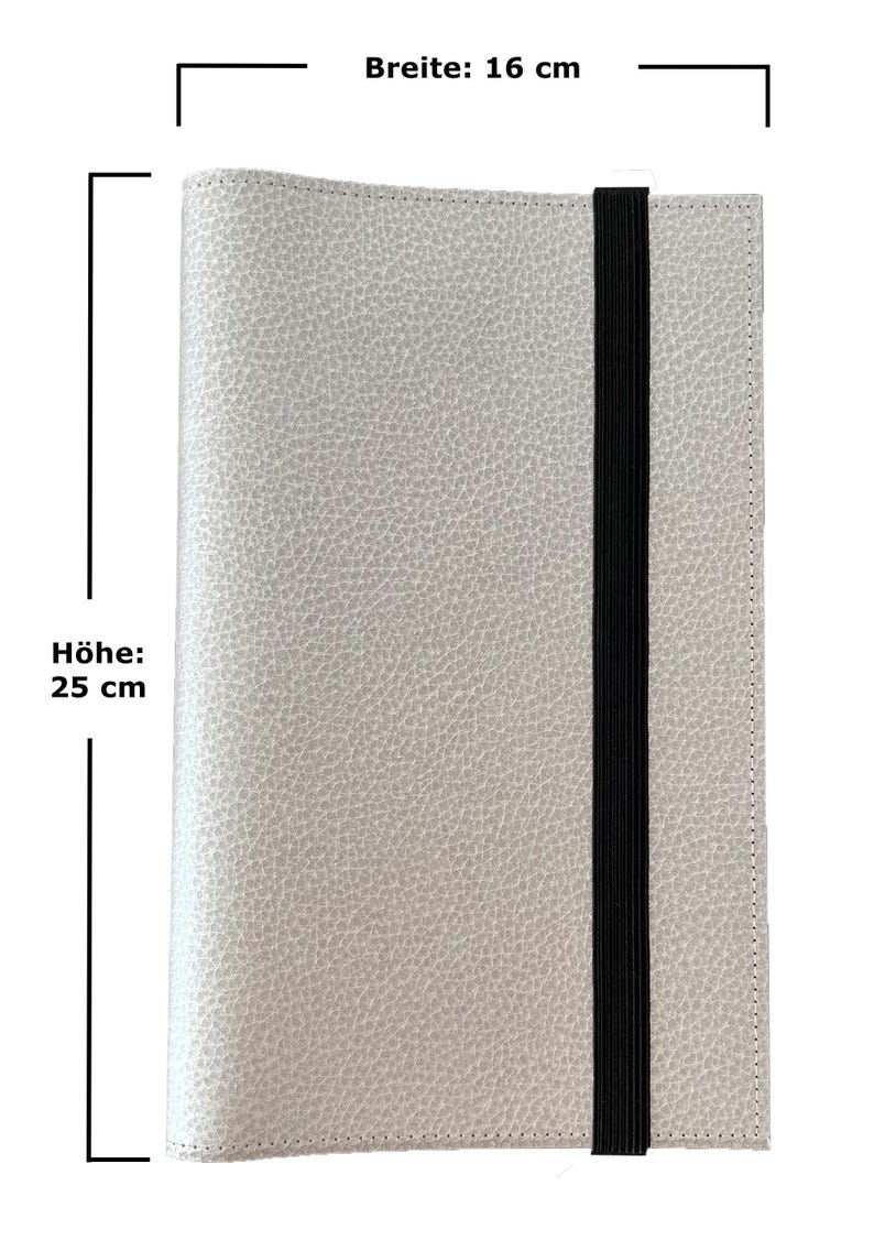 May include: A light gray leather notebook with a black elastic closure. The notebook measures 16 inches wide and 25 inches tall.