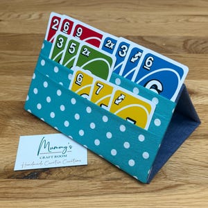 Playing card holder, hands free playing card holder, games accessory