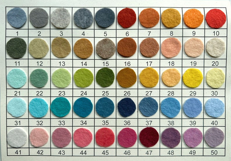 May include: A color chart with 50 felt circles in various colors, numbered 1 through 50.