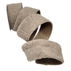 May include: A roll of taupe-colored ribbon with a fuzzy, textured surface. The ribbon is curled, revealing a brown underside. The ribbon is likely used for gift wrapping, crafting, or decorative purposes.