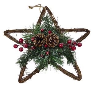 May include: A star-shaped wall hanging crafted from brown woven twigs, featuring a central arrangement of green pine needles, two brown pinecones, and clusters of small red berries, all lightly dusted with a white, snow-like texture.