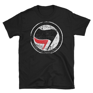 May include: Black t-shirt with a distressed white circle containing a black and red anarchy symbol.
