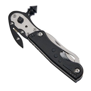 May include: A black multi-tool with a silver blade and a pointed tip. The tool has a built-in seatbelt cutter and window breaker.