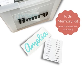 May include: A teal blue vinyl sticker with the name "Amelia" written in cursive. The sticker is on a white background. The image also shows a clear plastic storage box with the name "Henry" written on it in black vinyl. The box has folders labelled with different age groups and categories, such as "Infant", "Toddler", "Pre-K", "Kindergarten", "1st Grade", "2nd Grade", "3rd Grade", "4th Grade", "5th Grade", "6th Grade", "7th Grade", "8th Grade", "9th Grade", "10th Grade", "11th Grade", "12th Grade", "Medical", "Financial", "Keepsakes", and "Certificates". The image also includes a pink circle with the text "Kids Memory Kit (Box & Folders Not Included)".