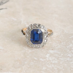 Art Deco 18 Carat Gold and Platinum Diamond and Blue Stone Cluster Panel Ring