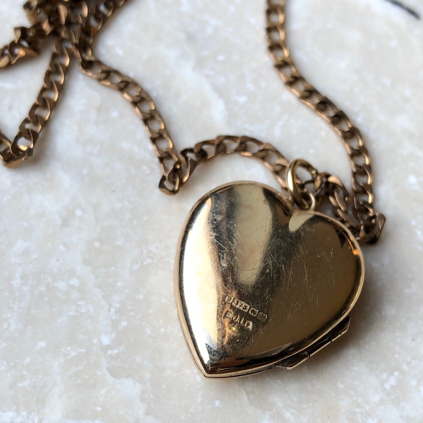 A large 9 carat gold locket