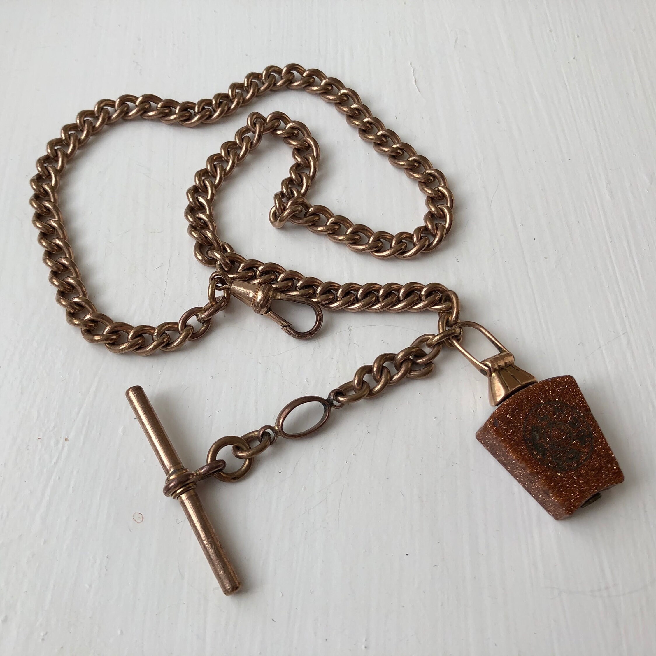 Antique Rolled Gold Albert Chain with a Goldstone Fob