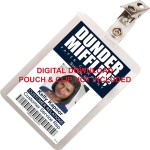 May include: A white plastic ID card holder with a blue and white Dunder Mifflin Paper Company logo. The holder has a clear plastic window for a photo and text that reads "DIGITAL DOWNLOAD POUCH & CLIP NOT INCLUDED". The photo shows Kelly Kapoor, Customer Service Rep.