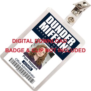 May include: A white plastic ID badge with a blue and white logo that says "Dunder Mifflin Paper Company Scranton, PA". The badge has a photo of a woman with brown hair and a purple shirt. The text on the badge reads "Pam Halpert Office Administrator ADMIN 00056190624563 TO-3". The badge is attached to a silver clip.