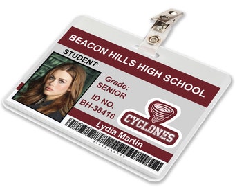 May include: A white plastic ID card with a red and white logo for Beacon Hills High School. The card has a photo of a young woman, the text "STUDENT", "Grade: SENIOR", "ID NO. BH-38416", "CYCLONES", and "Lydia Martin".